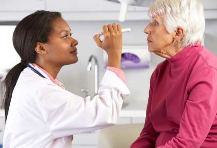 Doctor checking patients eyes